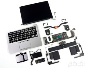 MacBook internal components including display, battery, logic board, fans and connectors